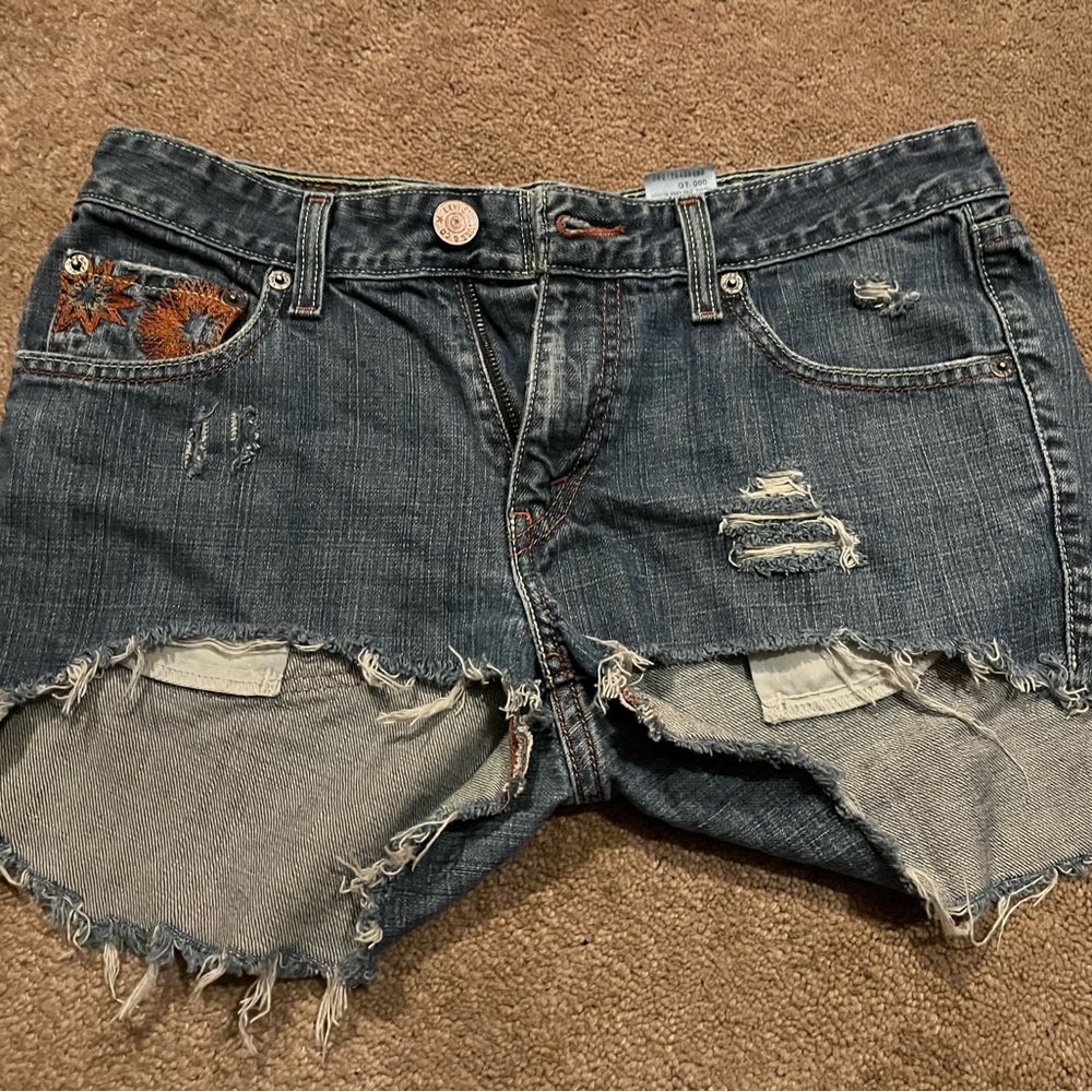 Distressed Denim Shorts with Embroidered Accents